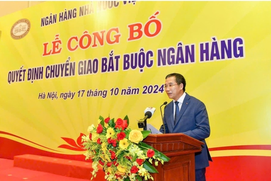 Chính thức chuyển giao bắt buộc 2 ngân hàng - ảnh 2